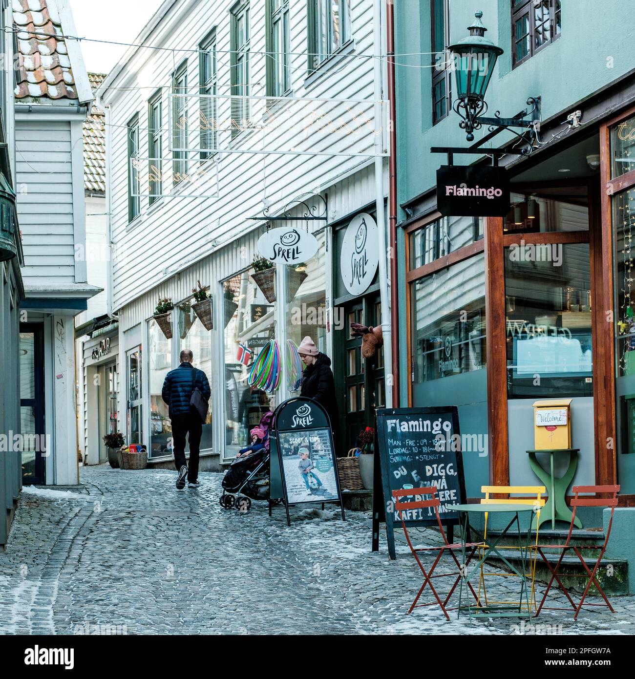 Stavanger, Norway, March 10 2023, People Walking Around Traditional Historic Old Town Stavanger Shopping Or Sightseeing Stock Photo