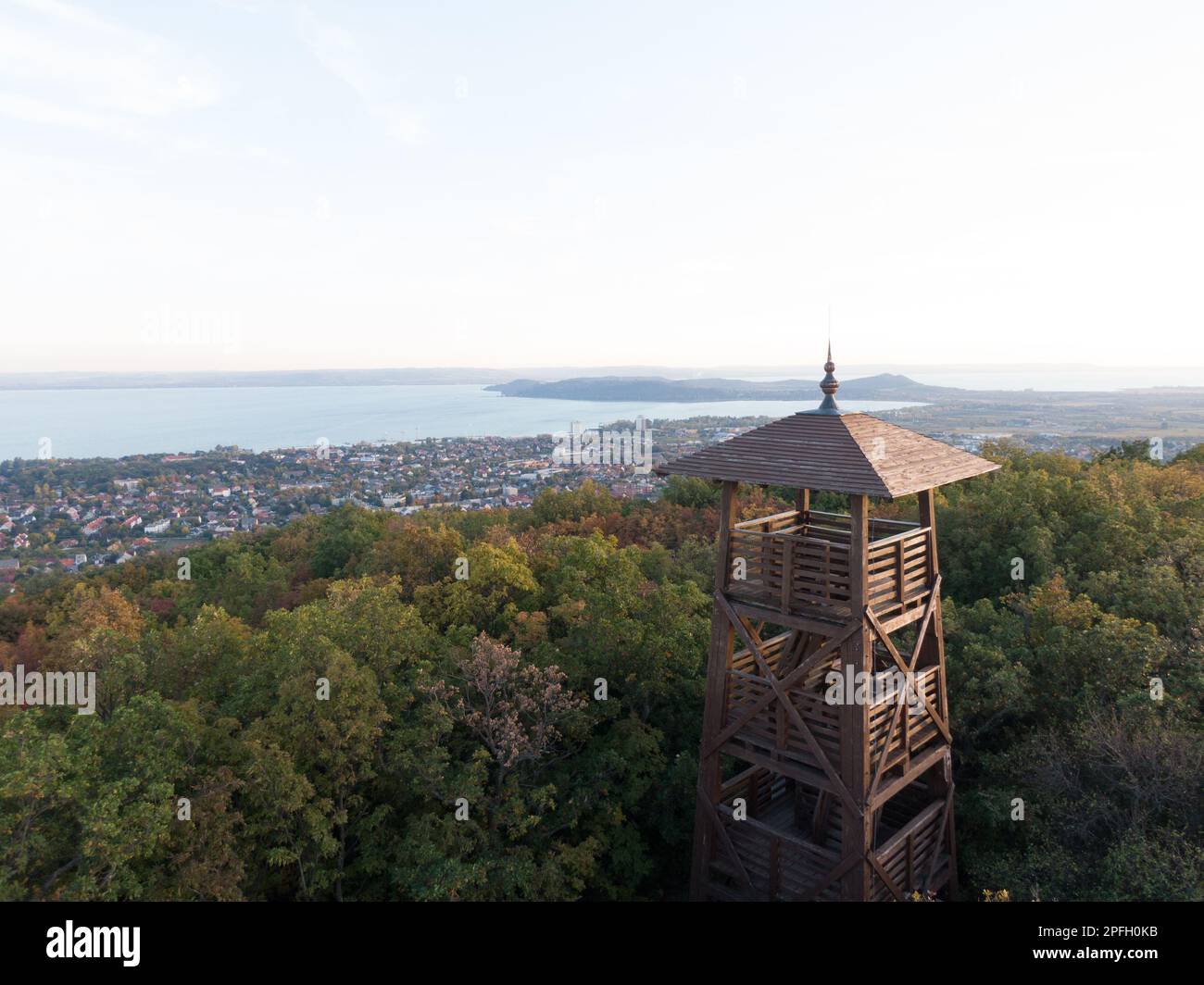 A picturesque scene of a small tower on top of a hill surrounded by ...