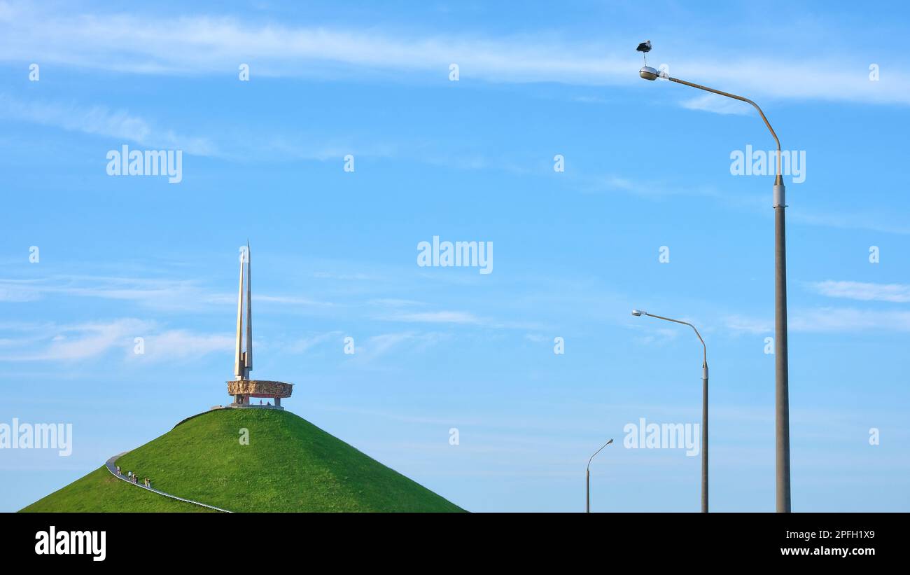 mound of glory against the blue sky and a lantern with a stork Stock Photo