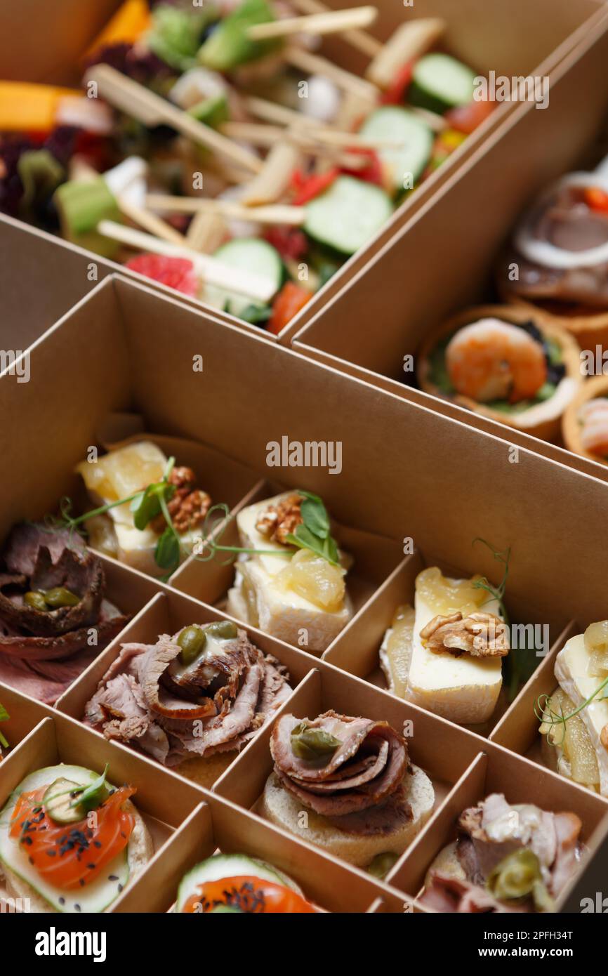 appetizers delivered in a box for food catering on a venue. Gourmet