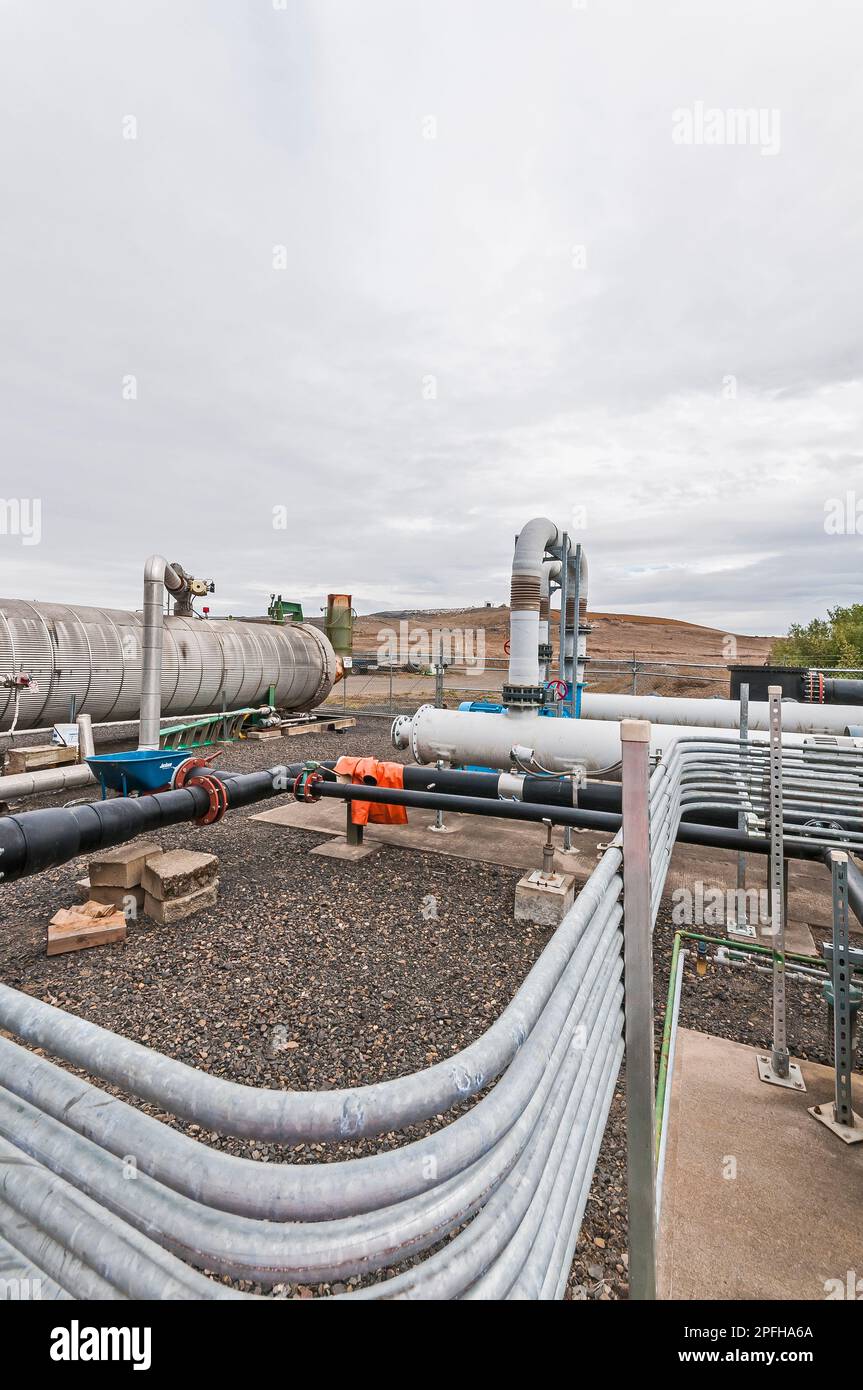 A fenced area containing tanks and piping for methane gas which is generated by and in an active