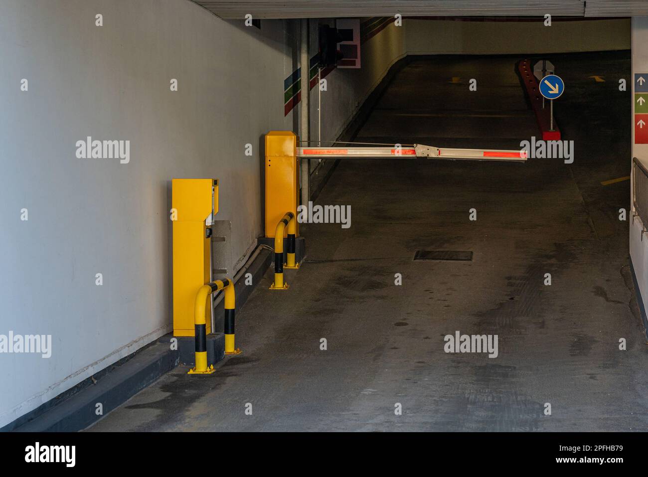 Entrance to a paid garage closed by a barrier. Stock Photo