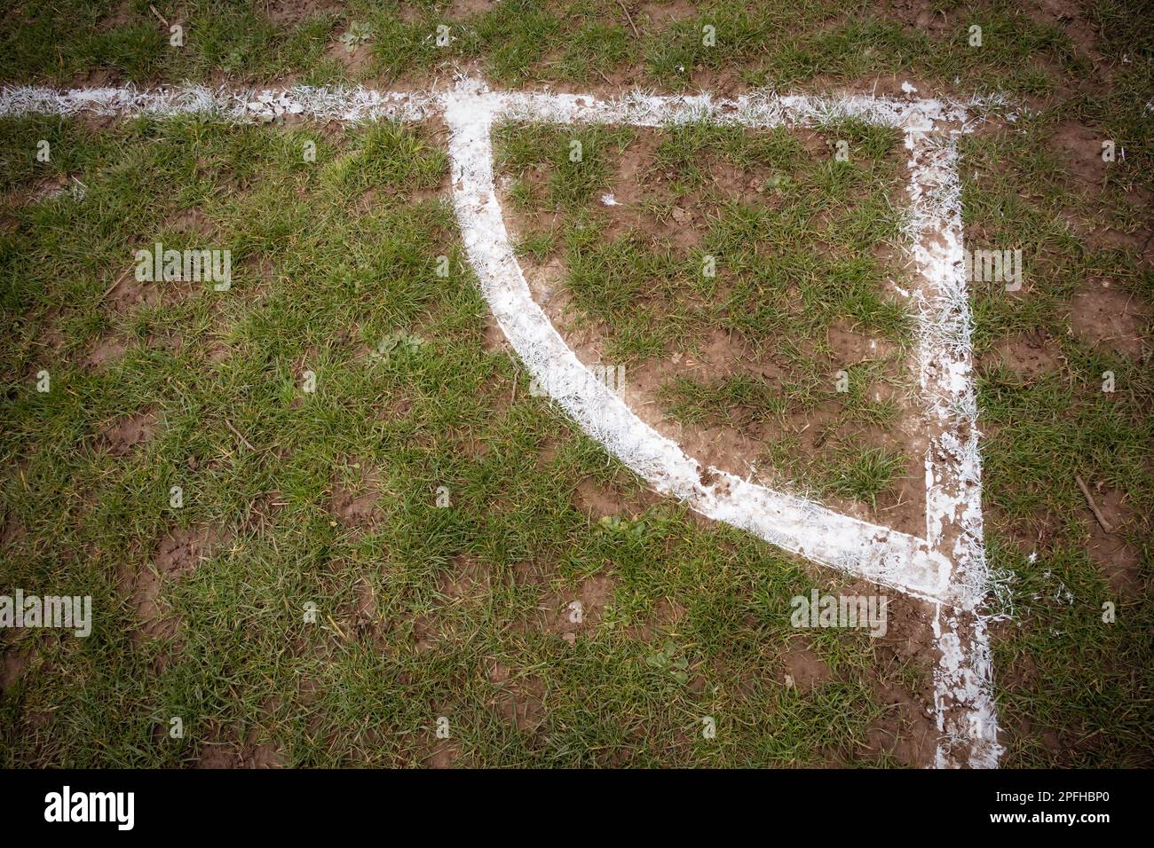 Football pitch markings at corner on muddy pitch Stock Photo Alamy