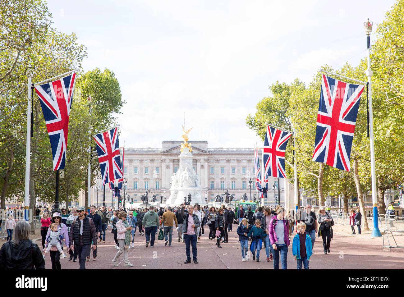 People walk on The Mall in London as many people gather around Buckingham Palace on the first Saturday since the state funeral of Queen Elizabeth II. Stock Photo