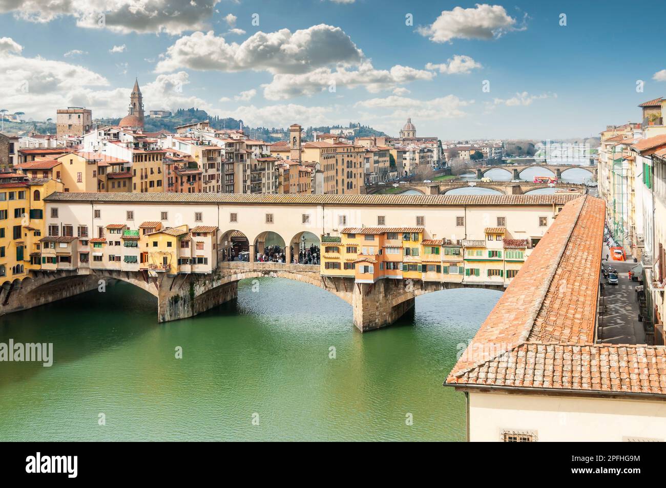 The Ponte Vecchio over the Arno from the Uffizi Gallery in Florence in Tuscany, Italy Stock Photo