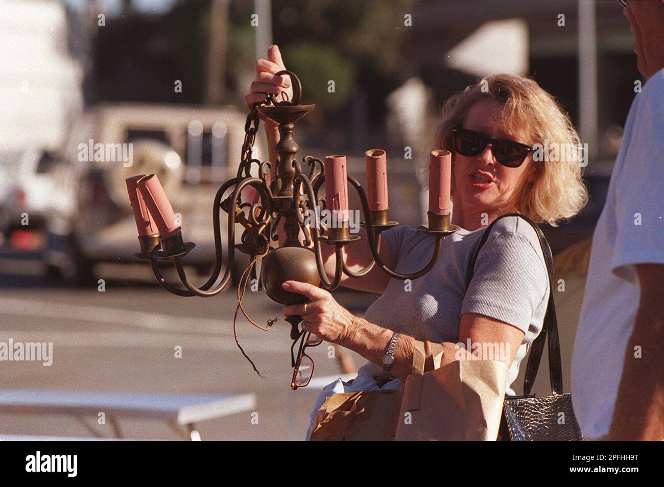 https://c8.alamy.com/comp/2PFHH9T/flea-4c02nov97cdls-lorraine-petersen-of-sebastopol-inspects-a-brass-chandelier-as-she-talks-with-the-owner-of-the-flea-market-booth-joe-henderson-it-was-priced-at-25-henderson-said-that-he-was-one-of-the-first-renters-at-the-flea-market-but-only-comes-about-once-a-month-it-keeps-you-from-getting-old-get-out-and-enjoy-life-come-on-out-and-mingle-with-the-people-henderson-explained-were-all-reasons-he-enjoyed-occasionally-selling-at-the-market-photo-by-lea-suzuki-lea-suzukisan-francisco-chronicle-via-ap-2PFHH9T.jpg
