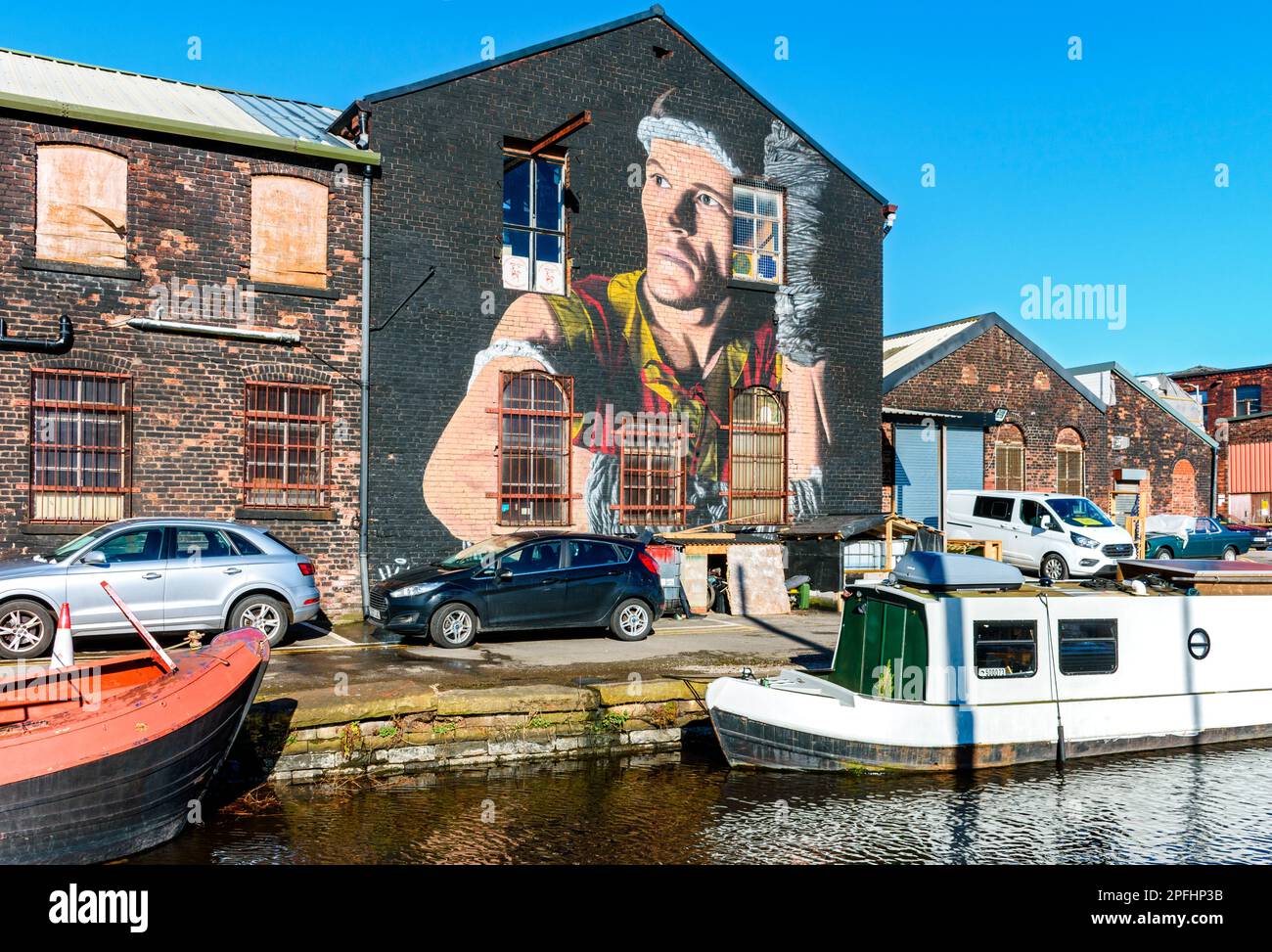 Mural by Akse P19, of Kru Steven Moore from the Sitsiam Camp martial arts centre.  By the  Huddersfield Narrow Canal., Ashton-under-Lyne, Tameside, UK Stock Photo