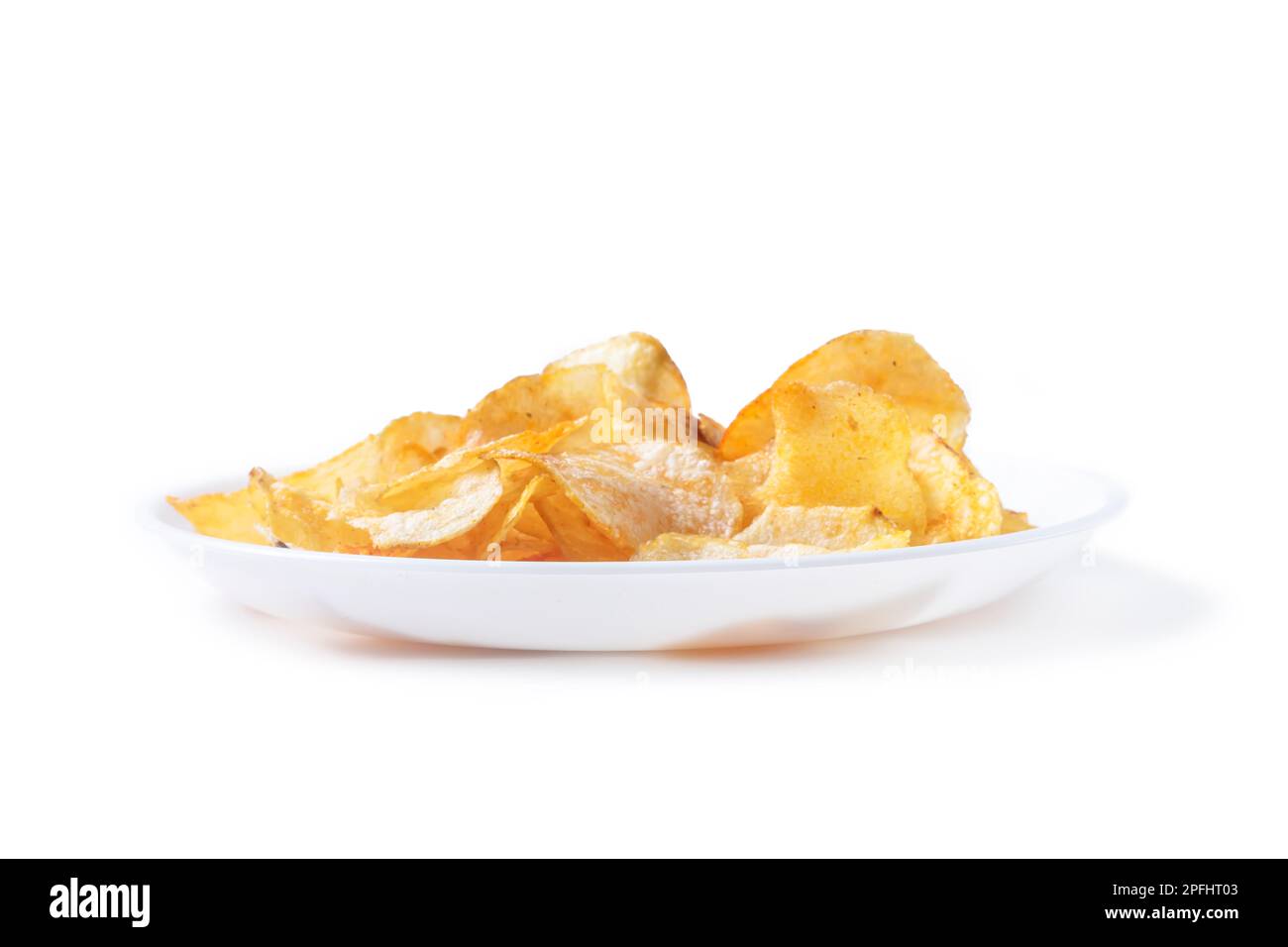 Potato chips on white plate isolated on white background, Selective focus. Stock Photo