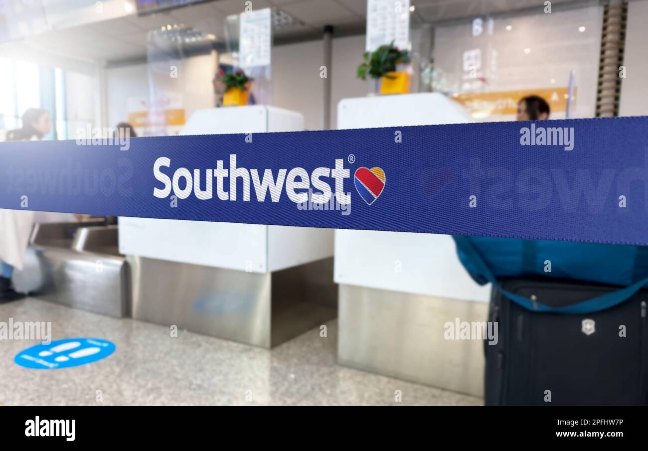 Atlanta, US Jan 2023: Blue barrier tape with the Southwest Airlines logo inside an airport. Southwest the largest low-cost carrier in the world. Trave Stock Photo