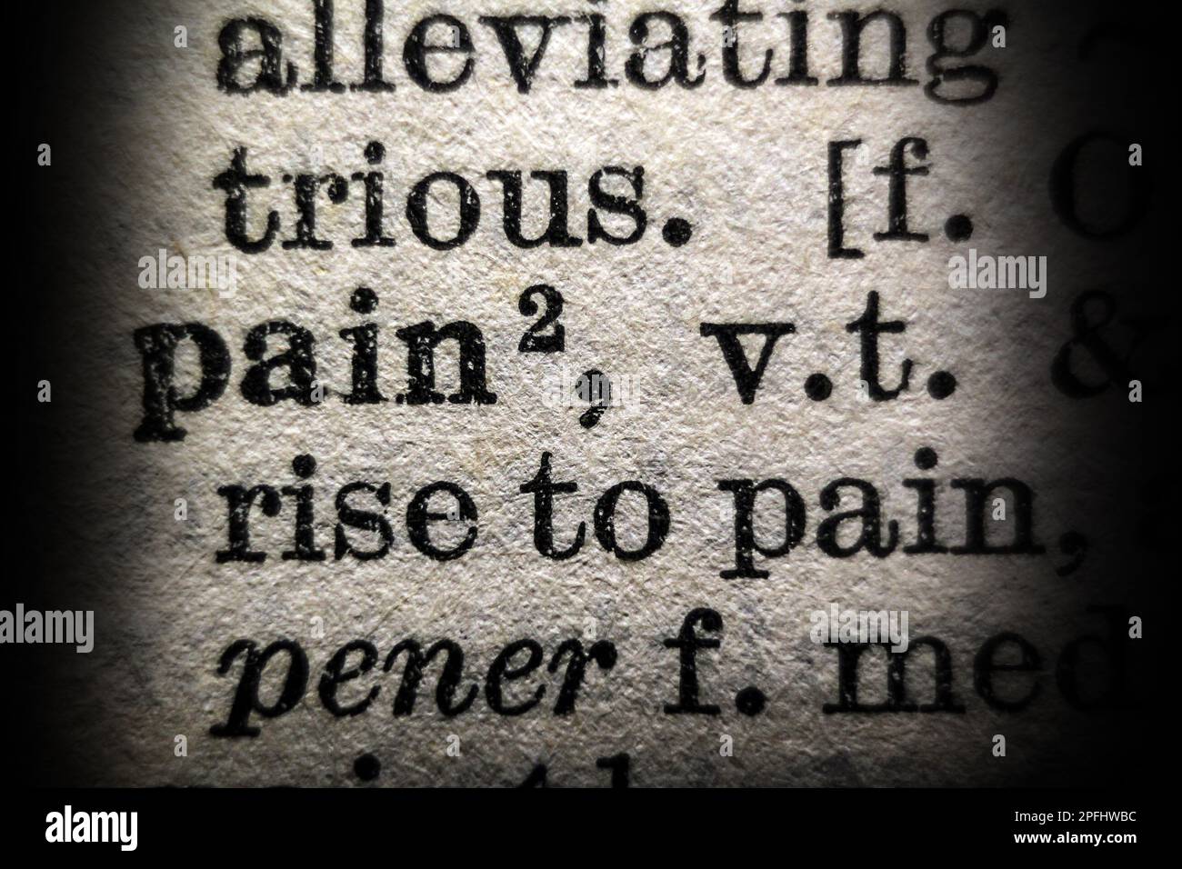 Definition of word pain on dictionary page, closeup Stock Photo Alamy
