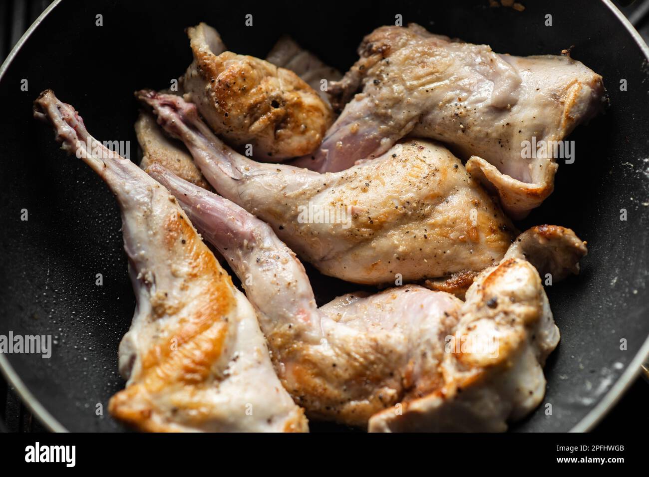 Raw rabbit with spices in a pan. Cooking stewed rabbit Stock Photo - Alamy