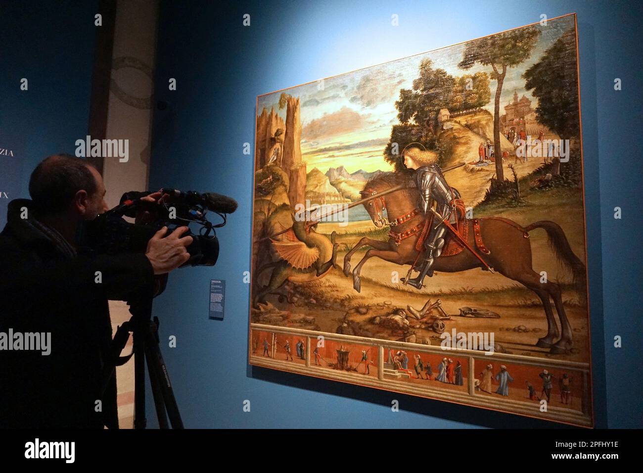 Venice, Italy. 17th Mar, 2023. A cameraman films 'San Giorgio killing the dragon', from the cycle of San'Orsola made by Vittore Carpaccio in 1516, today 17 March 2023 at the preview for the press at Palazzo Ducale. © ANDREA MEROLA A cameraman films 'Saint George kills the dragon', from the cycle of Saint Ursula made by Vittore Carpaccio in 1516, today 17 March 2023 at the press preview at Palazzo Ducale. © Andrew MEROLA Credit: Independent Photo Agency/Alamy Live News Stock Photo