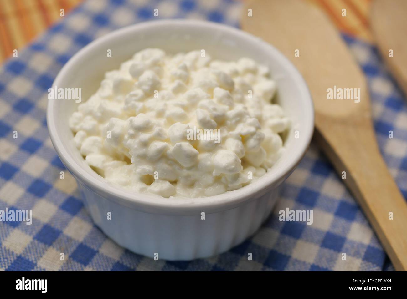 cottage cheese in a bowl on table  Stock Photo