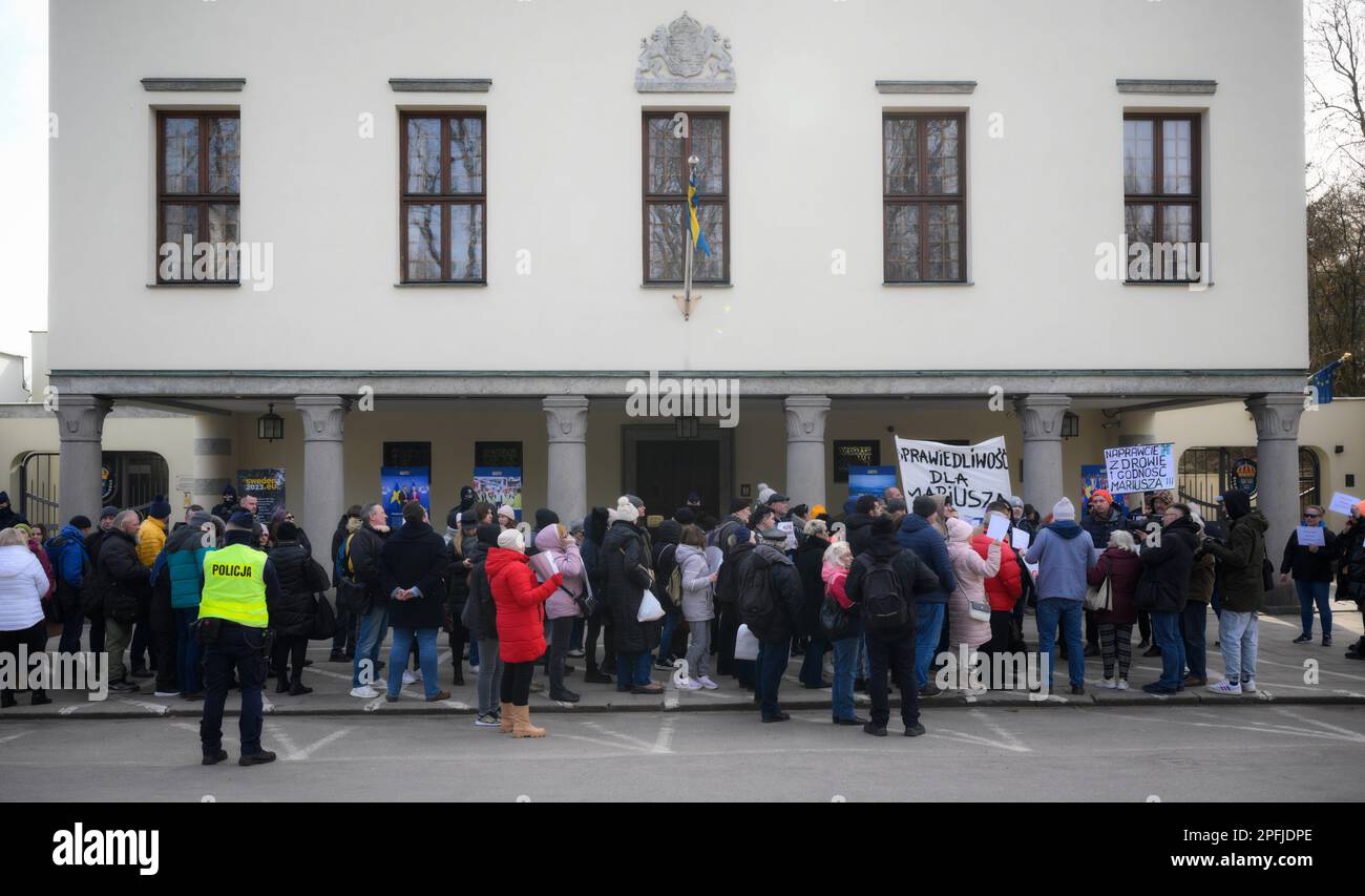 Family and supporters are seen rallying in front of the Swedish embassy in Warsaw, Poland on 17 March, 2023. Mariusz Dworakowski, a 47 year old Polish man arrested in December 2021 by Sweidsh police is currently serving time in jail in Sweden. Family membes say Mariusz was in the wrong place at the wrong time and was forced to remain lying on the street in freezing cold temperatures after suffering physical abuse by police. His family is demanding financial compensation for permanent injuries suffered during the arrest. Swedish authorities deny any wrongdoing by police and say the Mariusz will Stock Photo