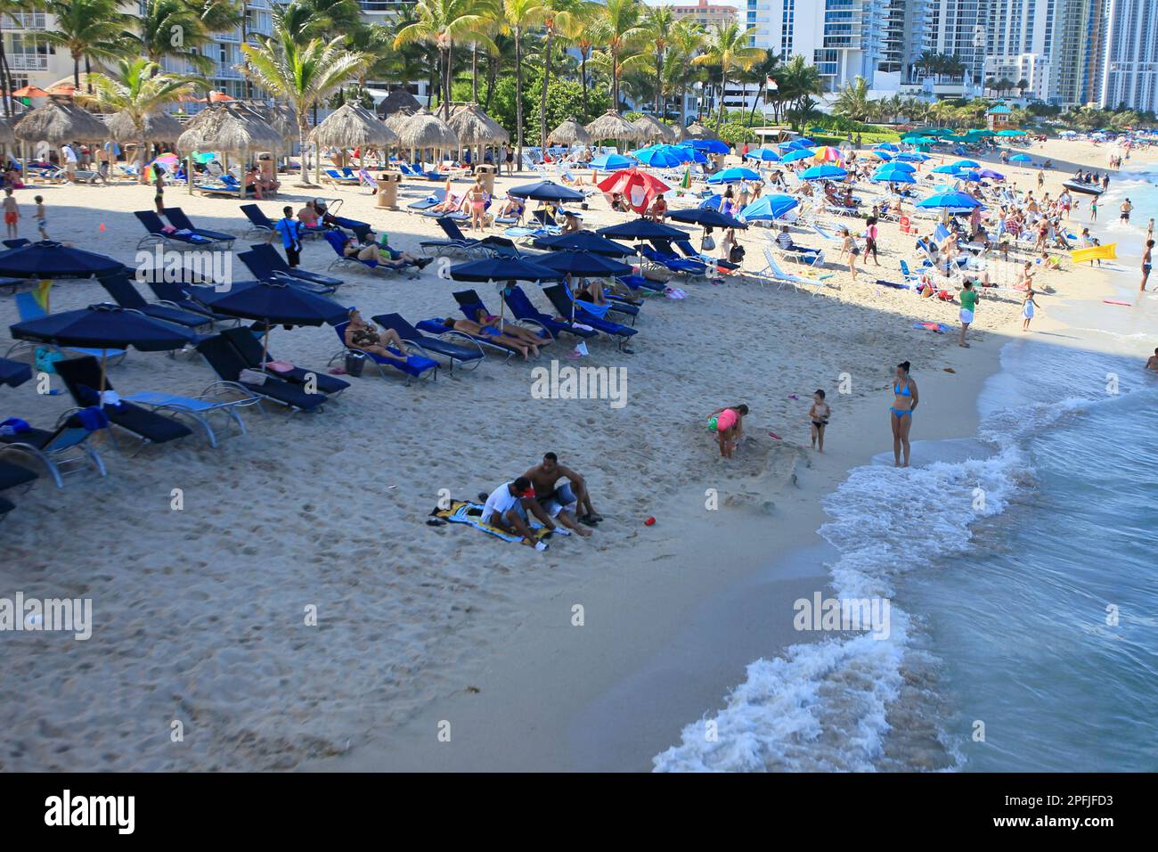 Sunny Isles Miami, FL. Tourist are seen in the beach of Sunny Isles.Photo by: José Bula Stock Photo