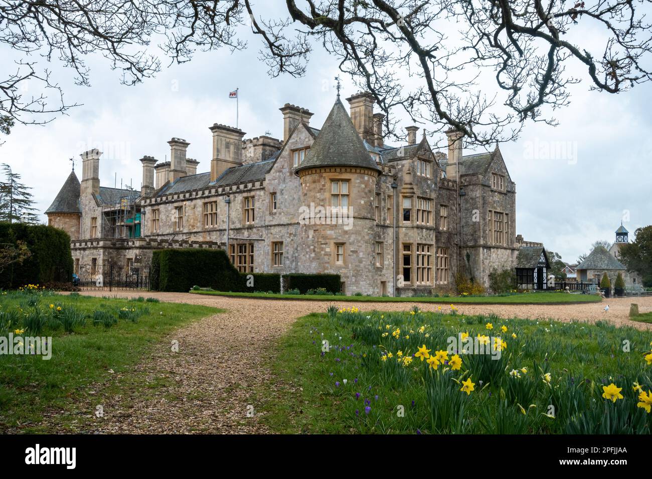 Beaulieu Palace House in spring with daffodils, New Forest, Hampshire, England, UK Stock Photo