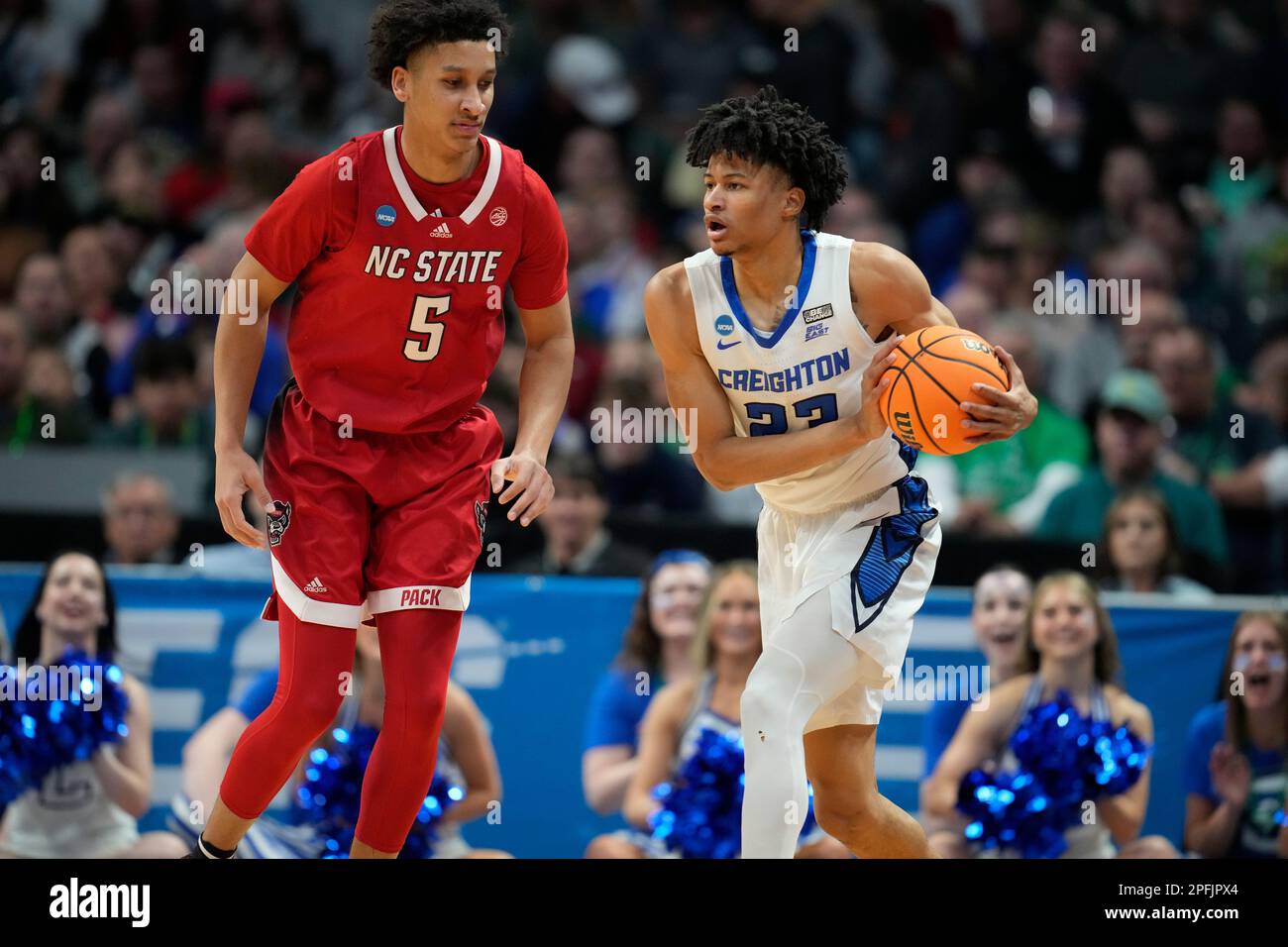 Creighton guard Trey Alexander, right, looks to pass the ball as North  Carolina State guard Jack Clark defends in the first half of a first-round  college basketball game in the men's NCAA