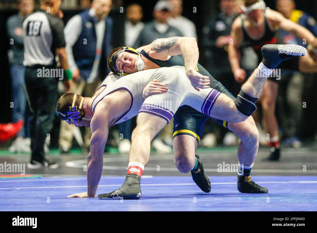 Michigan's Mason Parris takes down Northwestern's Lucas Davison at the