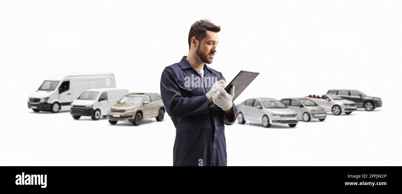 Mechanic writing a document in front of parked vehicles isolated on ...