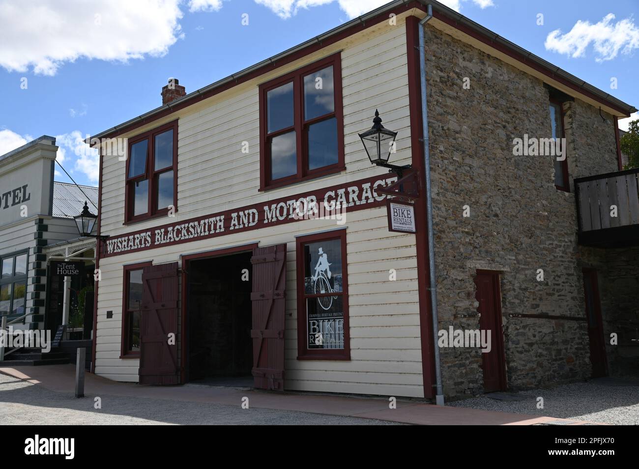 Wisharts blacksmith and motor garage one of only two buildings on its original site in Cromwell's Heritage Precinct. The building dates from 1880. Stock Photo