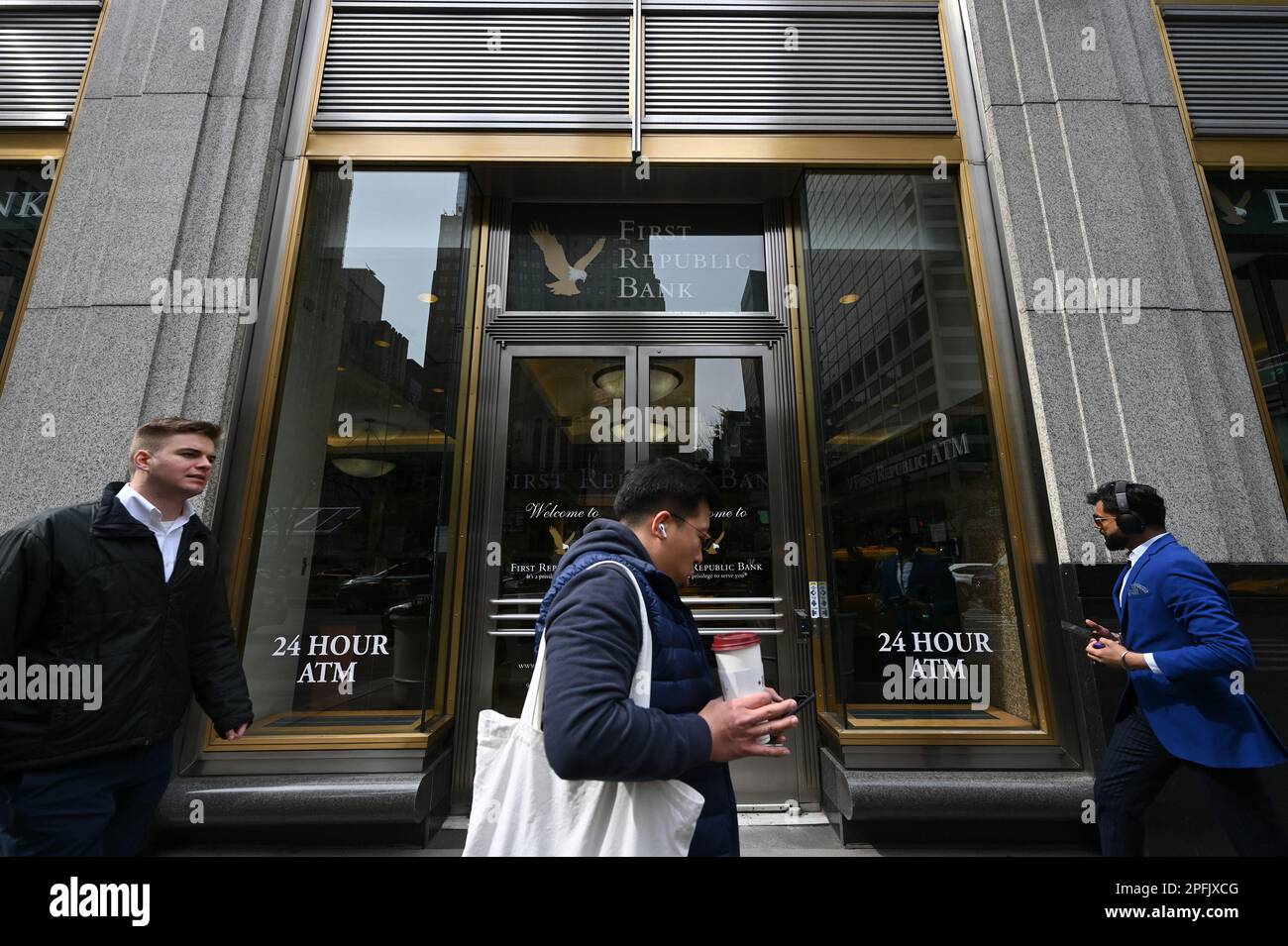 New York, USA. 17th Mar, 2023. Pedestrians walk past a First Republic