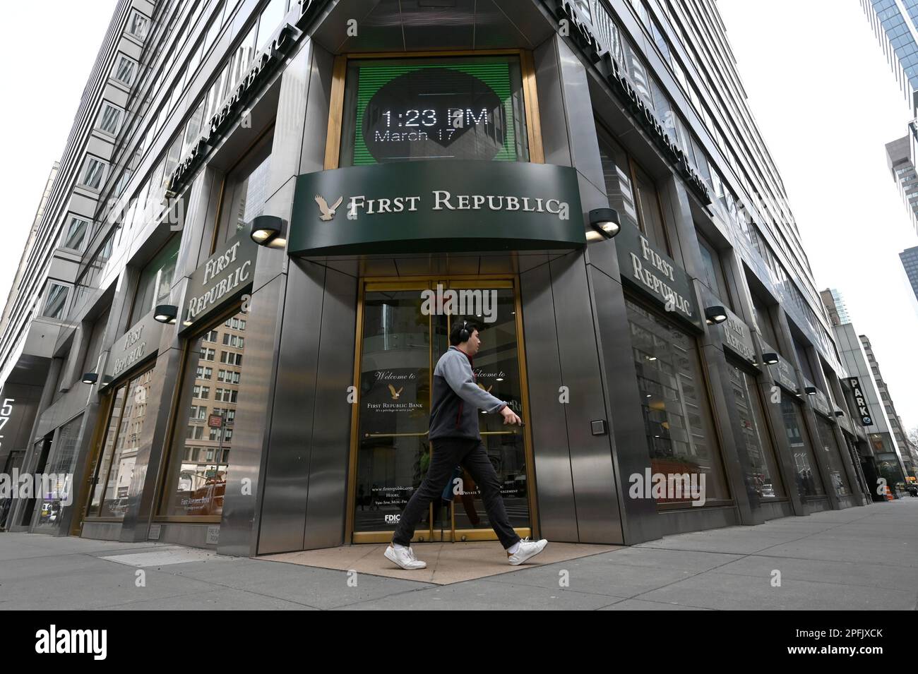 New York, USA. 17th Mar, 2023. A pedestrian walks past the entrance of