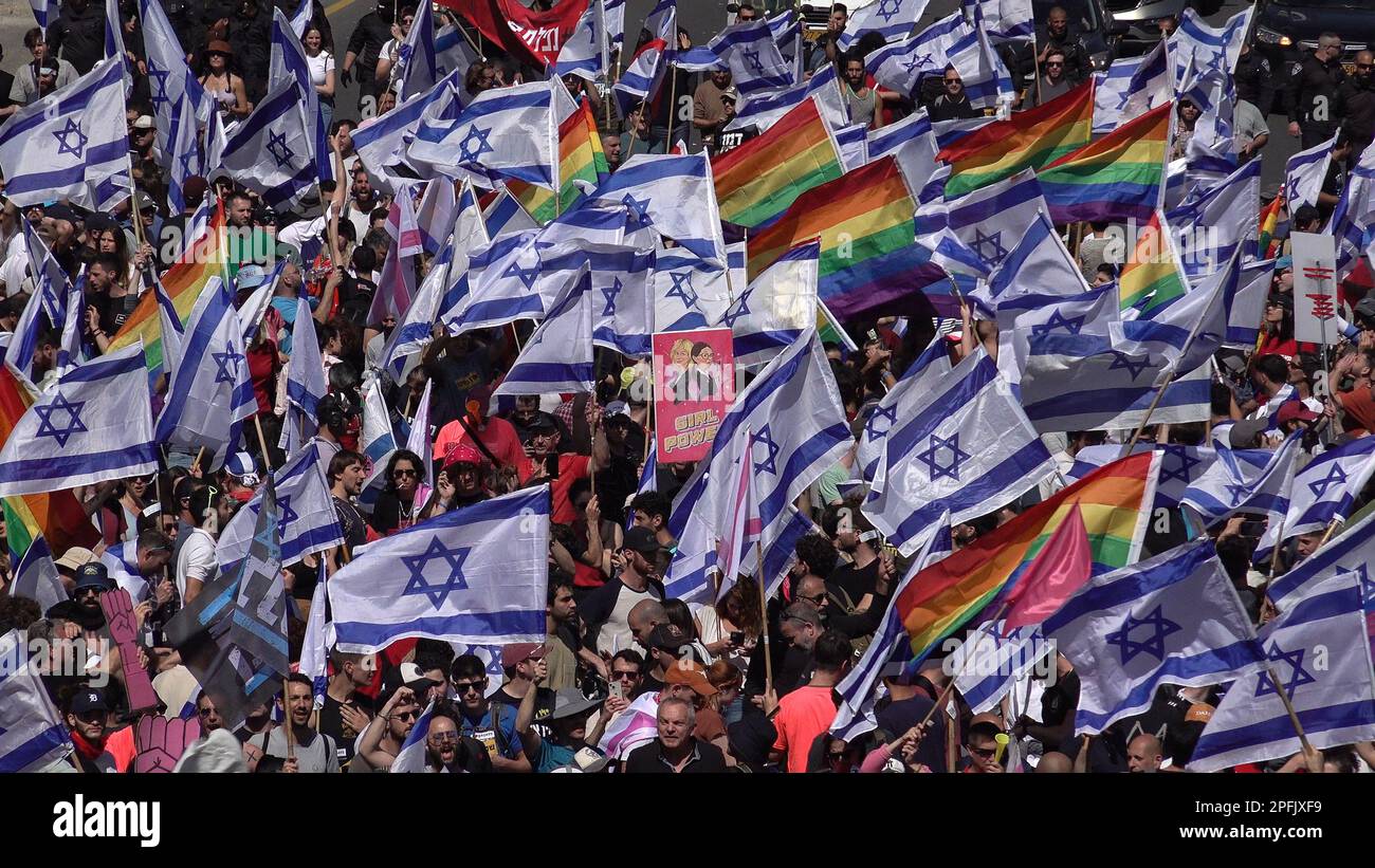 TEL AVIV, ISRAEL - MARCH 16: Anti-government protesters hold Israeli flags and traditional gay pride rainbow flags, during a demonstration against Israel's Prime Minister Benjamin Netanyahu's new right-wing coalition and its proposed judicial changes. on March 16, 2023 in Tel Aviv, Israel. Credit: Eddie Gerald/Alamy Live News Stock Photo