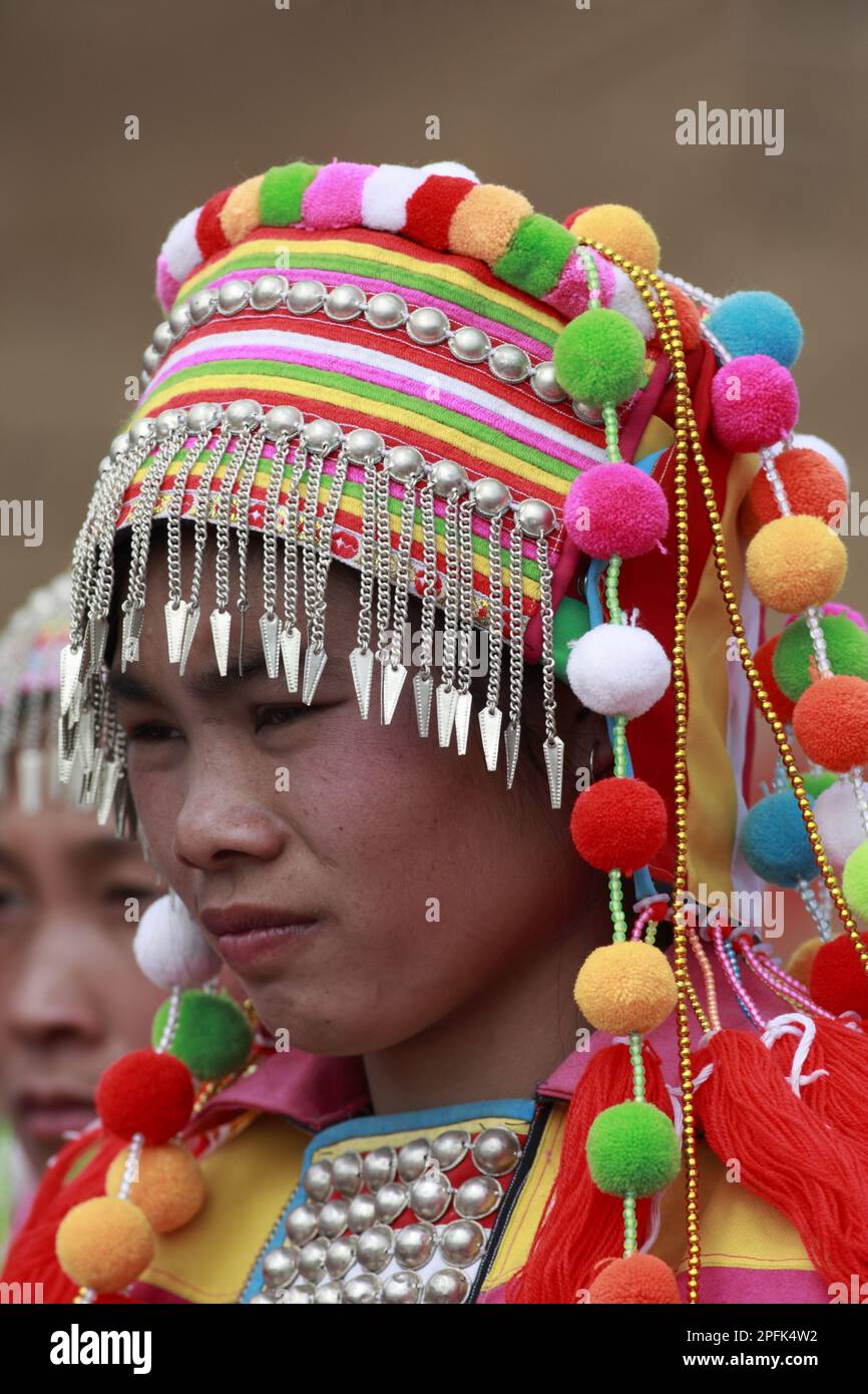 Lisu ethnic minority tribe, dancer in traditional dress, close-up of head, Husa, Western Yunnan, China Stock Photo