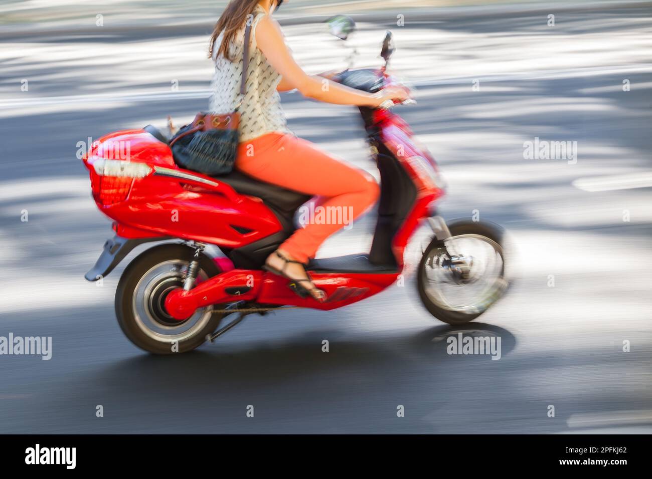 picture-with-camera-made-motion-blur-effect-of-a-young-woman-riding-a