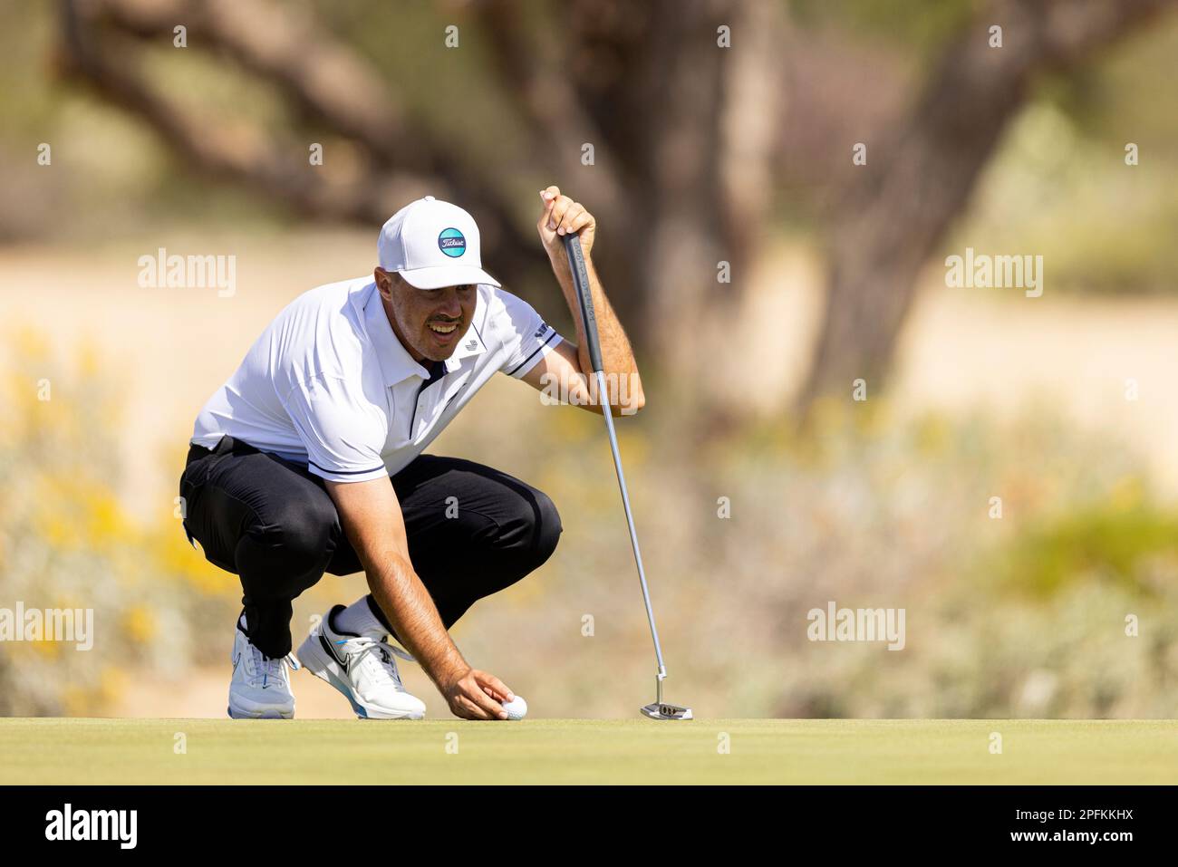 Chase Koepka of Smash GC lines his putt on the 13th green during the