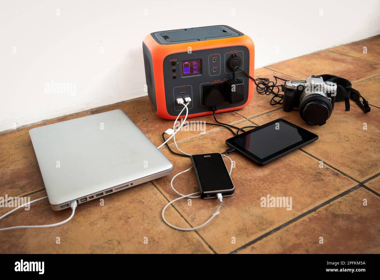 Portable power station solar electricity generator with laptop, phone