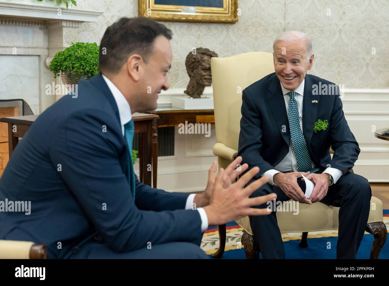 Washington, United States Of America. 17th Mar, 2023. Washington, United States of America. 17 March, 2023. U.S President Joe Biden, wearing a bunch of shamrocks in his breast pocket, chats with Irish Taoiseach Leo Varadkar, left, during the traditional St. Patrick's Day visit at the Oval Office of the White House, March 17, 2023 in Washington, DC Credit: Cameron Smith/White House Photo/Alamy Live News Stock Photo