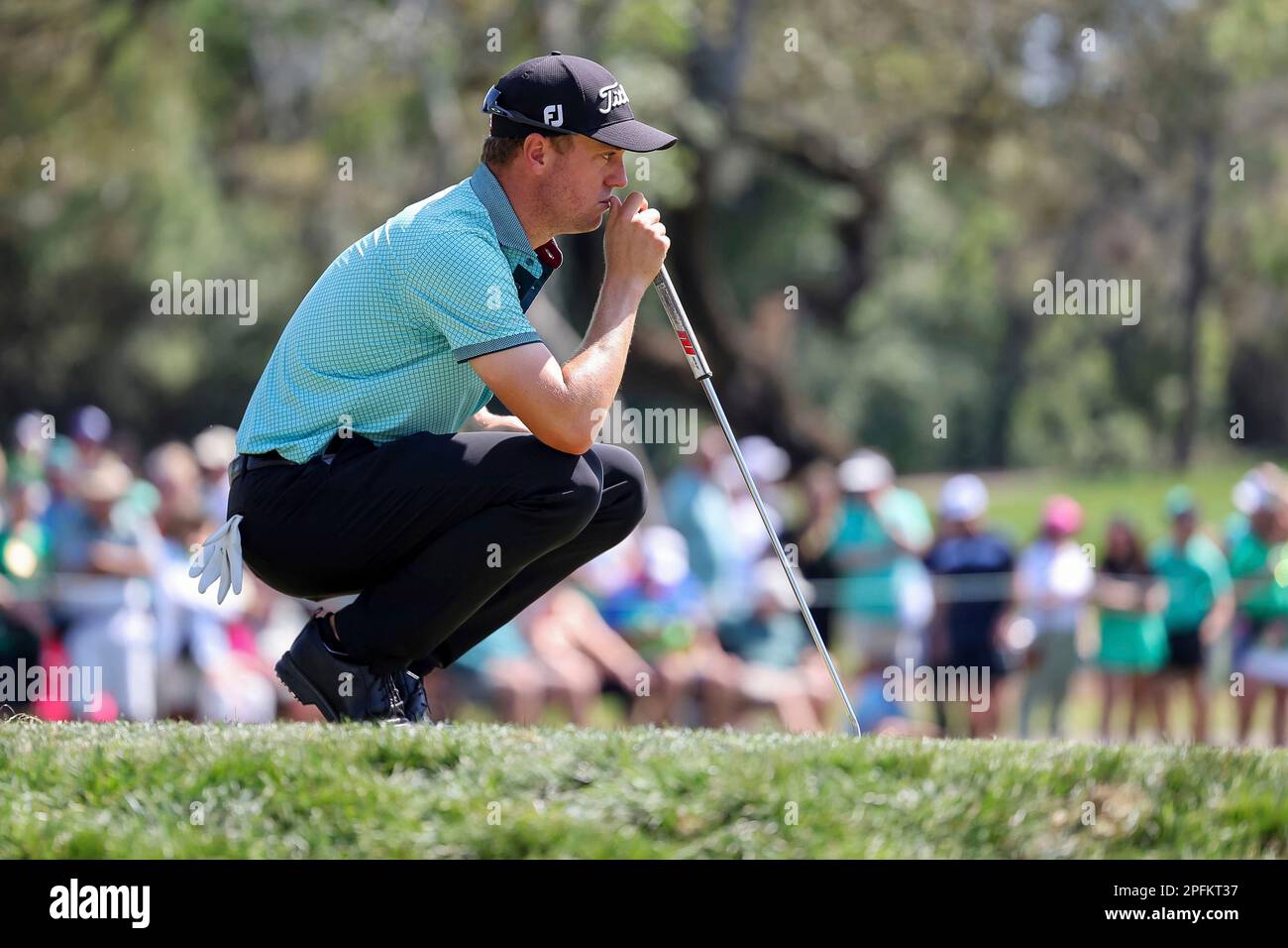 Justin Thomas lines up a putt on the sixth hole during the second round