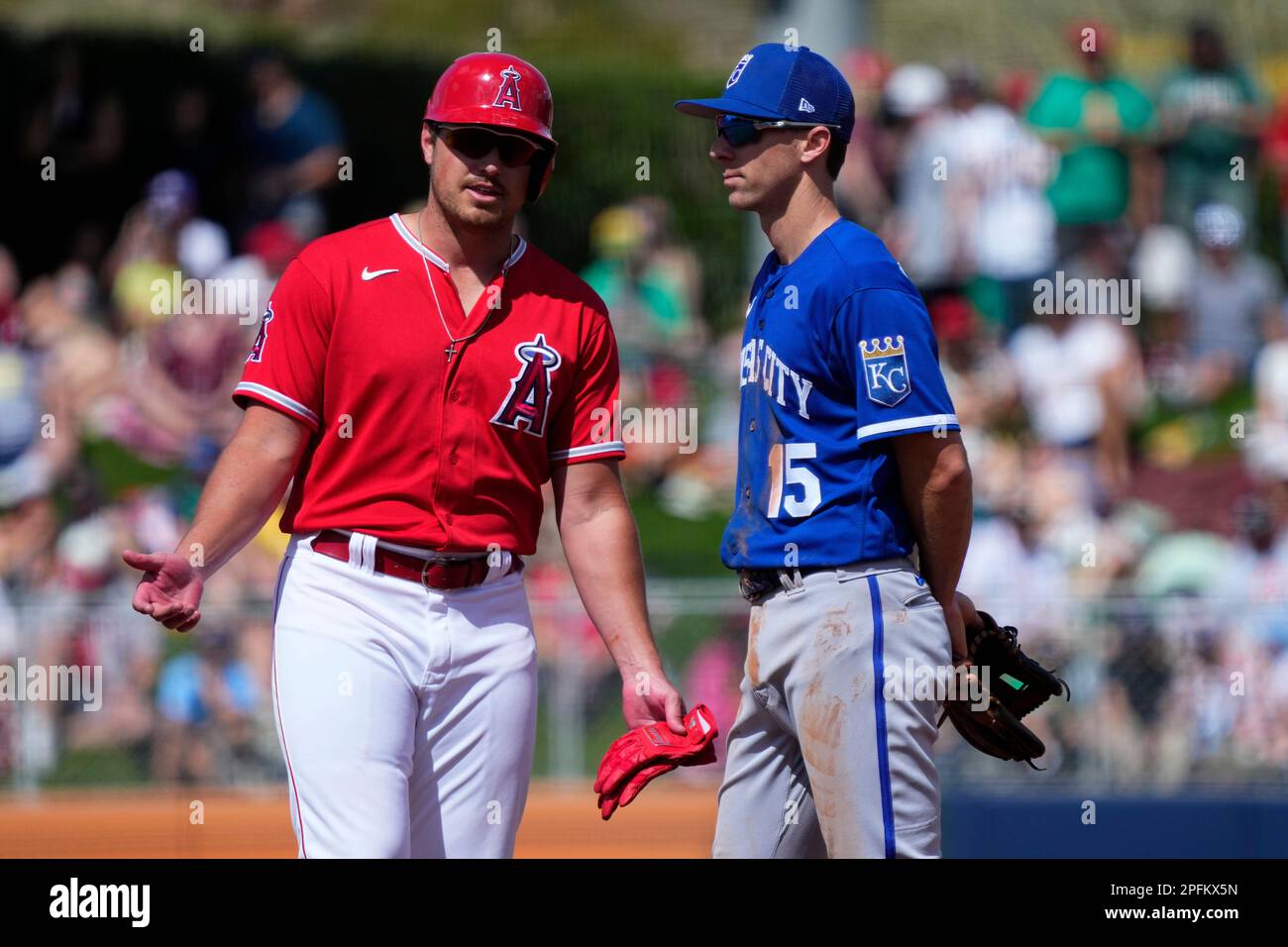 Los Angeles Angels' Hunter Renfroe talks with Kansas City Royals Matt Duffy  (15) after hitting a double during the second inning of a spring training  baseball game, Friday, March 17, 2023, in