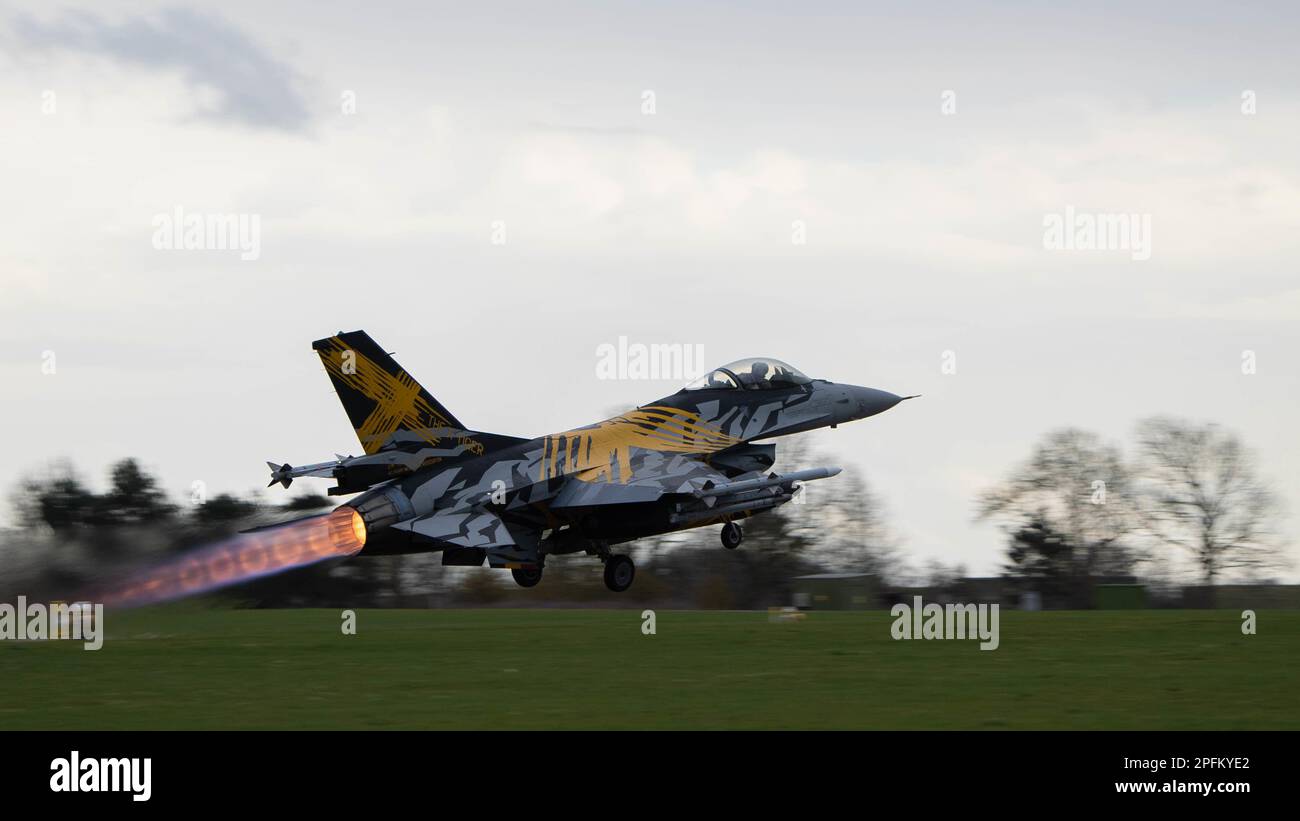A Belgian Air Force F-16 Fighting Falcon takes-off at Royal Air Force Waddington, England, prior to a training mission for Exercise Cobra Warrior 23-1 March 14, 2023. Cobra Warrior provides valuable opportunities for all participating nations to develop tactical interoperability skills with partners, aircrew and supporting elements within a composite air operation environment. (U.S. Air Force photo by Airman 1st Class Austin Salazar) Wing. Stock Photo
