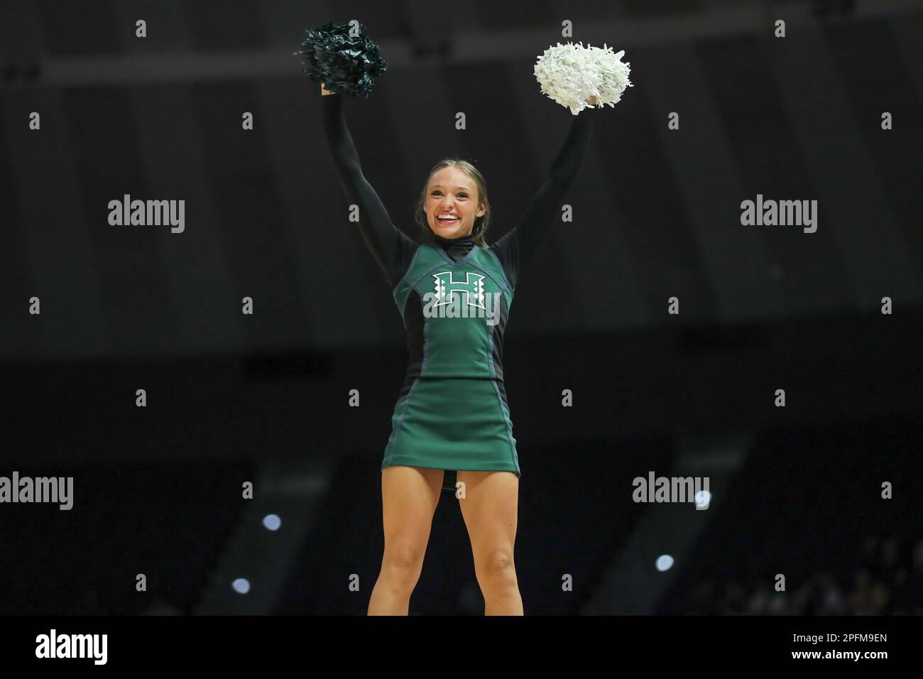 Baton Rouge, LA, USA. 17th Mar, 2023. A Hawaii cheerleader waves to the crowd during first round action of the NCAA Women's March Madness Tournament between the Hawaii Rainbow Wahine and the LSU Tigers at the Pete Maravich Assembly Center in Baton Rouge, LA. Jonathan Mailhes/CSM/Alamy Live News Stock Photo