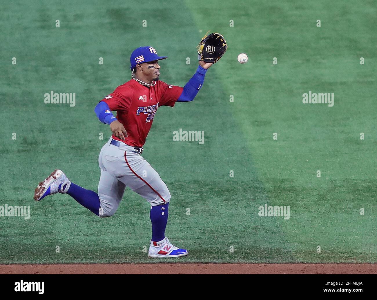 Miami, United States. 17th Mar, 2023. Puerto Rico's Francisco Lindor (12) makes a play on a ball in the second inning during the 2023 World Baseball Classic quarter-final game against Mexico in Miami, Florida on Friday, March 17, 2023. Photo by Aaron Josefczyk/UPI Credit: UPI/Alamy Live News Stock Photo