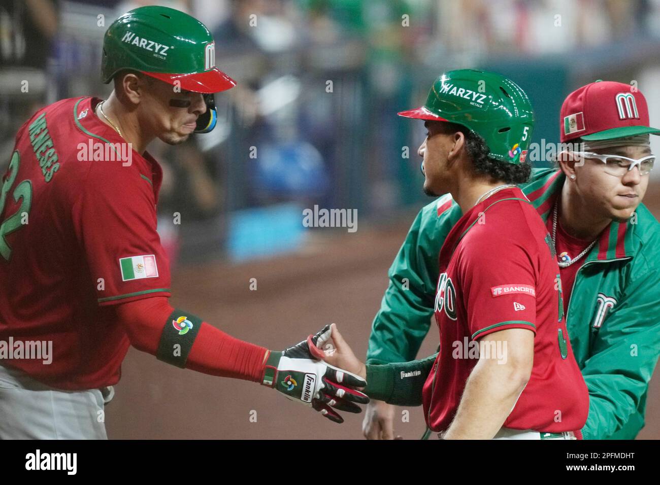 Mexico center fielder Alek Thomas (5), right, is congratulated after  scoring a run on a hit by Alex Verdugo (27) in the fifth inning of a World  Baseball Classic game against Puerto