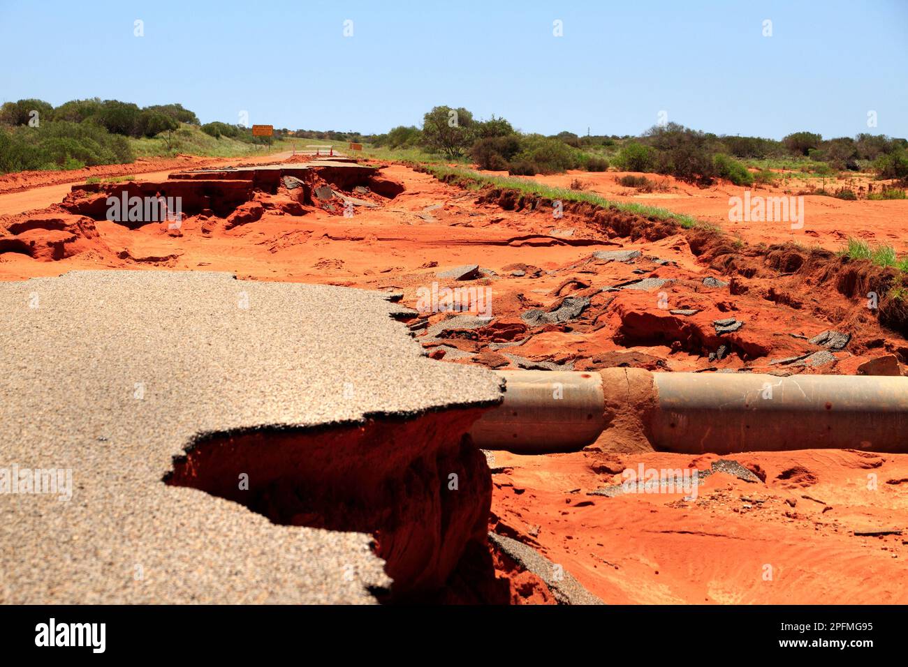 Damaged road due to flood water, Northwest Australia Stock Photo