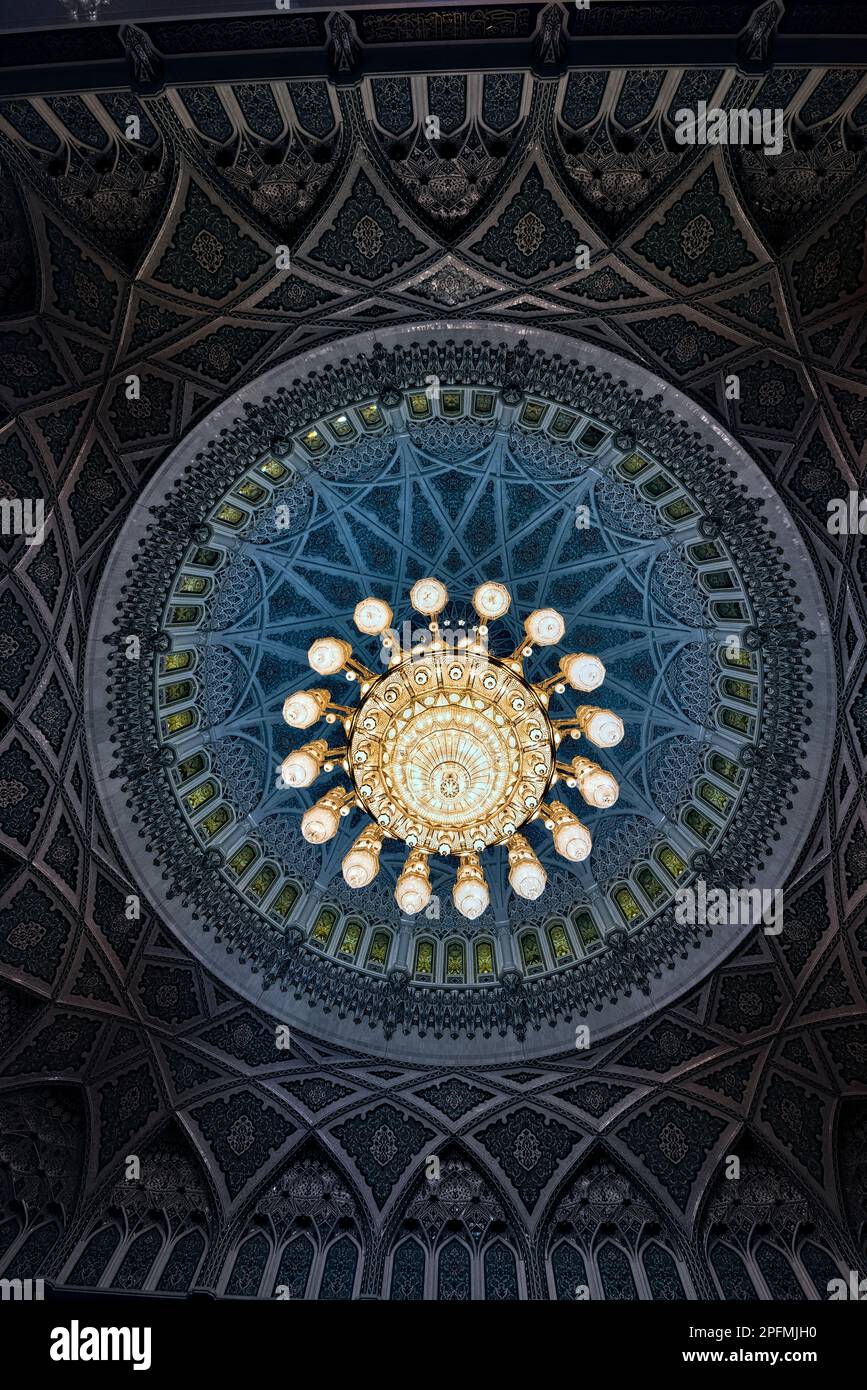Bejeweled crystal and gold chandelier in the Sultan Qaboos Grand Mosque, Muscat, Oman Stock Photo