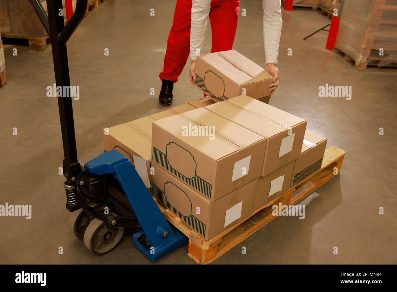Worker sorting cardboard boxes in warehouse, closeup. Logistics concept ...