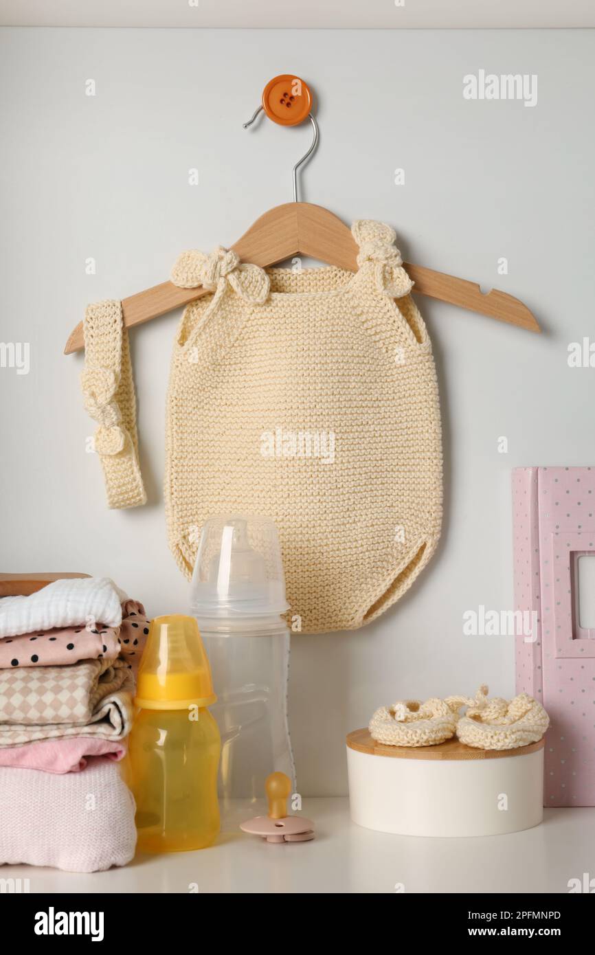 Baby clothes and accessories on white rack Stock Photo Alamy