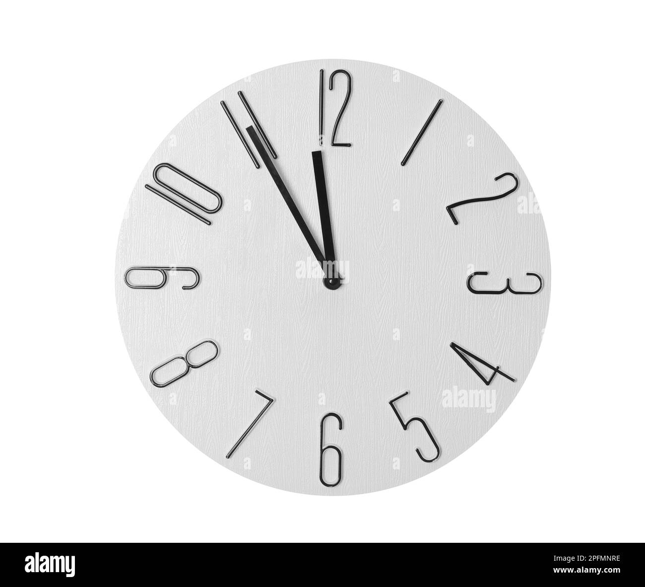 Clock showing five minutes until midnight on white background. New Year