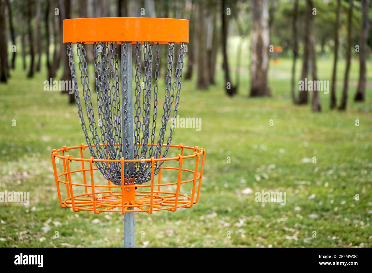 Closeup of disc golf (frolf) basket in a park obstacle course with a shallow depth of field Stock Photo