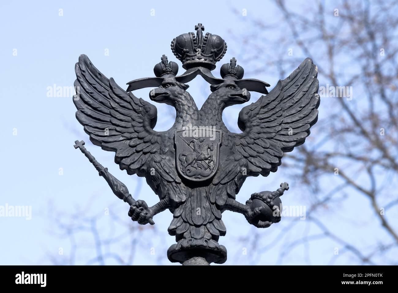 KRONSTADT, RUSSIA - MARCH 13, 2023: The old skullpture of the two-headed eagle is the coat of arms of the Russian Empire. Fragment of the design of th Stock Photo