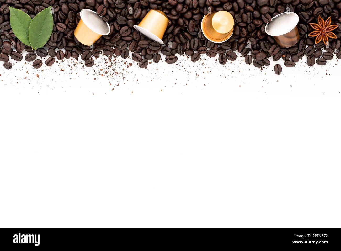 Dark roasted coffee beans setup on white background with copy space ...