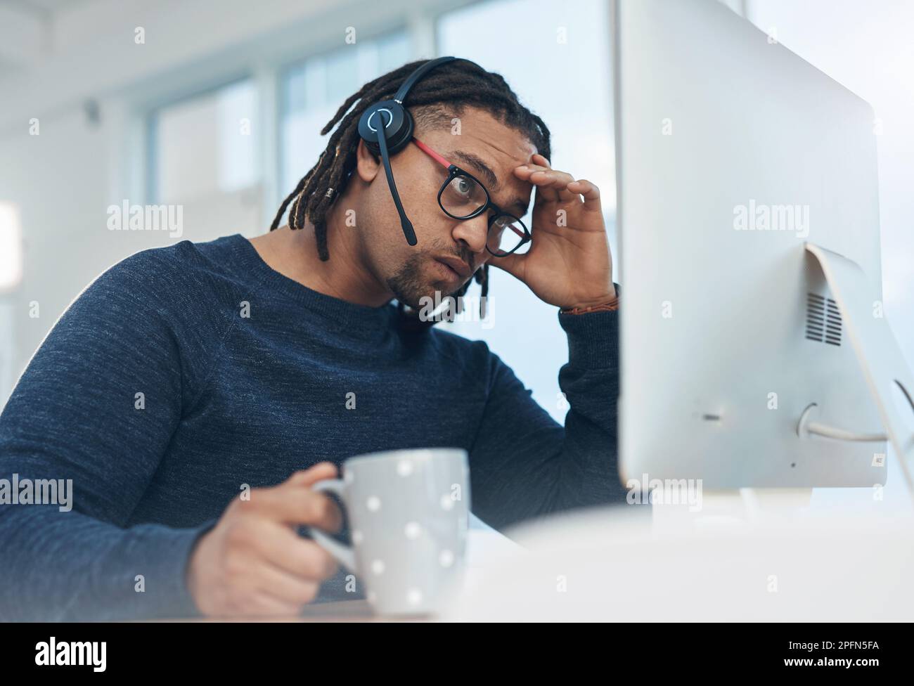 Have I hit a dead-end. a young businessman wearing a headset and ...