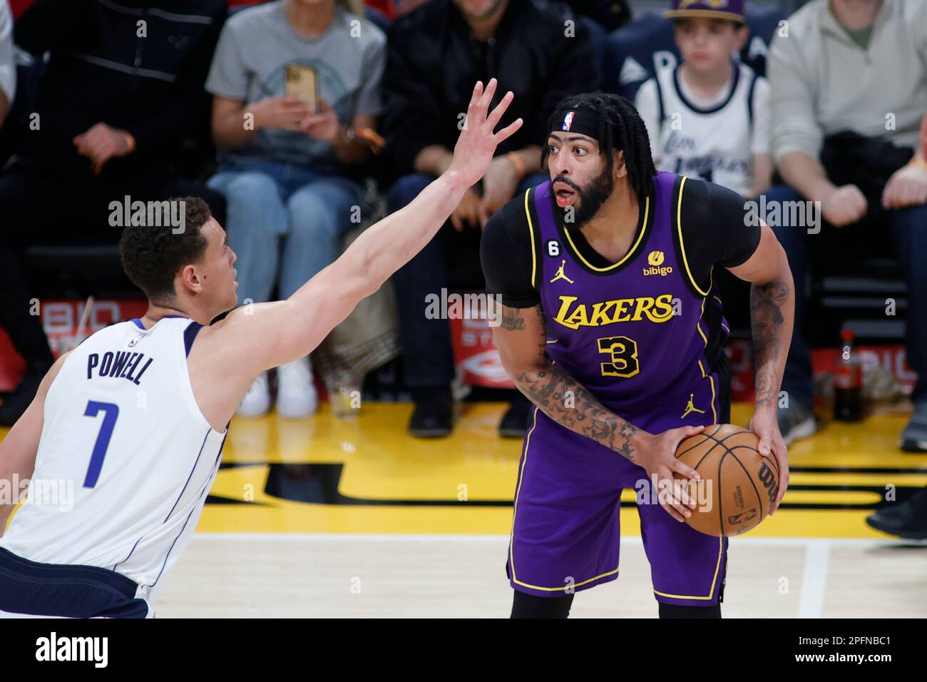 Los Angeles, United States. 17th Mar, 2023. Los Angeles Lakers forward Anthony Davis (R) is defended by Dallas Mavericks forward Dwight Powell (L) during an NBA basketball game at Crypto.com Arena in Los Angeles. Credit: SOPA Images Limited/Alamy Live News Stock Photo