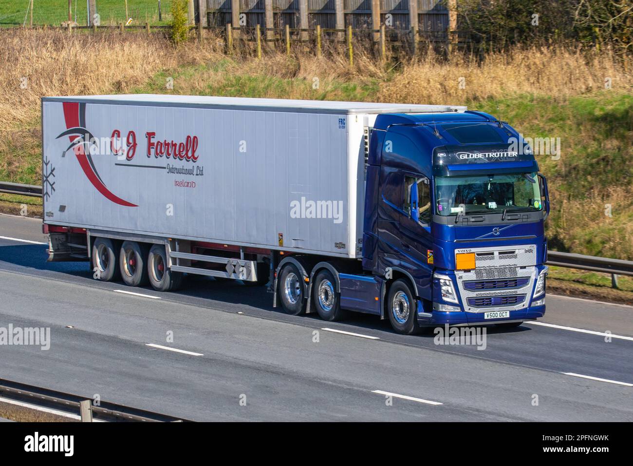 C J FARREL International Ltd, Ireland.  VOLVO FH Globetrotter lorry travelling on the M6 motorway, UK Stock Photo