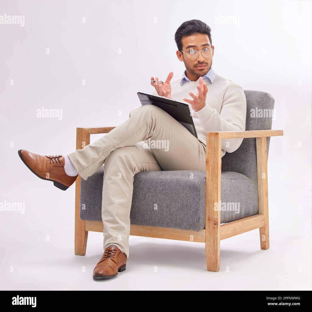 Psychology, psychologist and portrait of man on chair with clipboard in